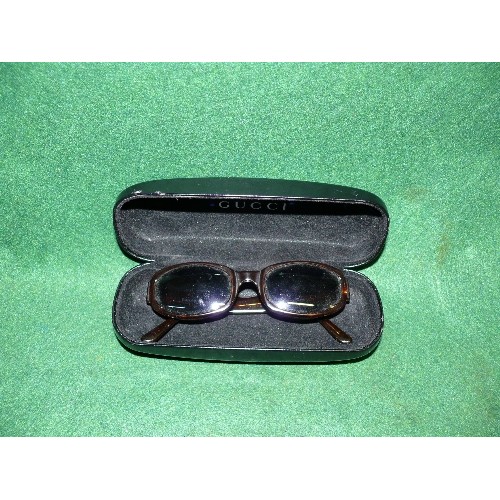 6 - ARMANI SUNGLASSES IN A GUCCI CASE