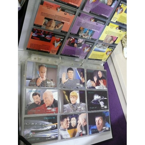 65 - A FOLDER CONTAINING 7 SETS OF STAR TREK COLLECTORS CARDS  INCLUDING 4 CHASE CARDS