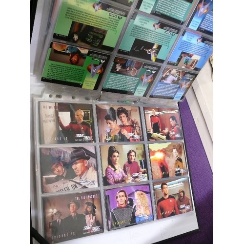 65 - A FOLDER CONTAINING 7 SETS OF STAR TREK COLLECTORS CARDS  INCLUDING 4 CHASE CARDS