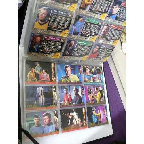 65 - A FOLDER CONTAINING 7 SETS OF STAR TREK COLLECTORS CARDS  INCLUDING 4 CHASE CARDS