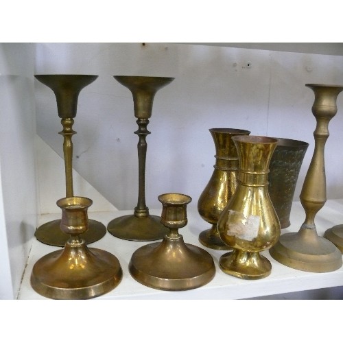 97 - THREE PAIRS OF DECORATIVE BRASS CANDLESTICKS PLUS TWO PAIRS OF DECORATIVE BRASS VASES.