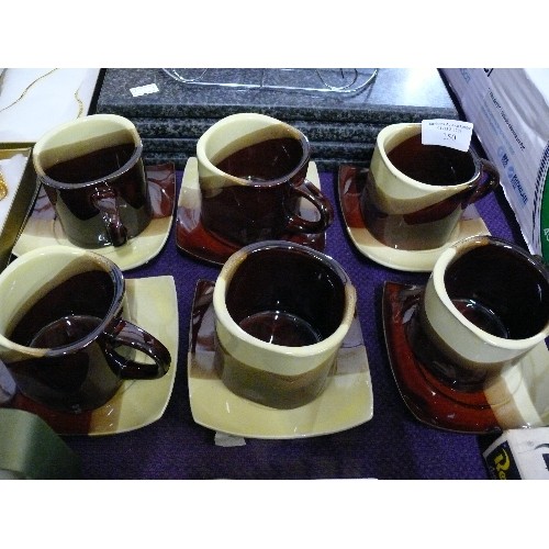 150 - SET OF SIX COFFEE CUPS AND SAUCERS PLUS GRANITE PLACEMATS AND A KITCHEN STAND.