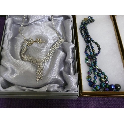 154 - FIFTEEN BOXED NECKLACES, VARIOUS DESIGNS INCLUDING A BUTTERFLY, FLOWER AND FLORAL HEART.