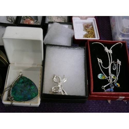 165 - A LARGE SELECTION OF MIXED COSTUME JEWELLERY, ALL BOXED, MOSTLY DECORATIVE PENDANTS AND CHAINS.