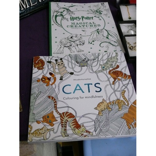 A HARRY POTTER MAGICAL CREATURES COLOURING BOOK PLUS A FURTHER CAT