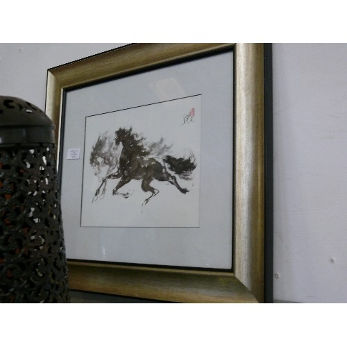 175 - A FRAMED AND GLAZED INK DRAWING OF TWO PRANCING HORSES