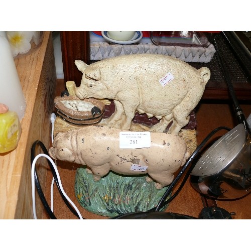 281 - TWO DECORATIVE CAST IRON PIG DOORSTOPS