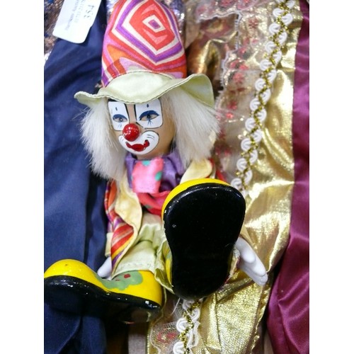 354 - A COLLECTION OF DECORATIVE PORCELAIN CLOWNS