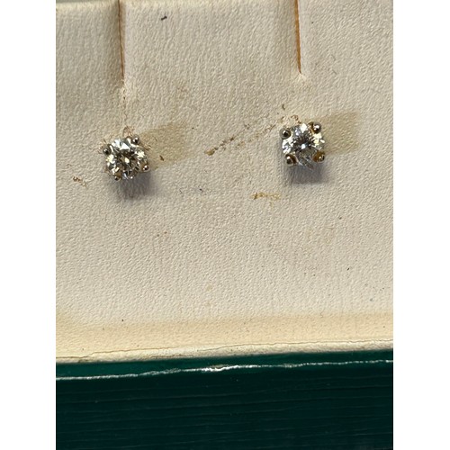 20 - A PAIR OF 18CT GOLD AND DIAMOND STUD EARRINGS BOXED WEIGHT .8GR