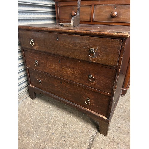 517 - EARLY 20TH CENTURY OAK 3 DRAWER CHEST. BACK LEG NEEDS RE ATTACHING