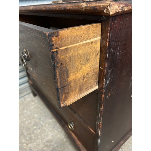 517 - EARLY 20TH CENTURY OAK 3 DRAWER CHEST. BACK LEG NEEDS RE ATTACHING