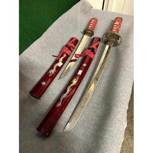 62A - TWO JAPANESE SAMURAI TYPE SHORT SWORDS WITH DECORATIVE LACQUERED SCABBARDS