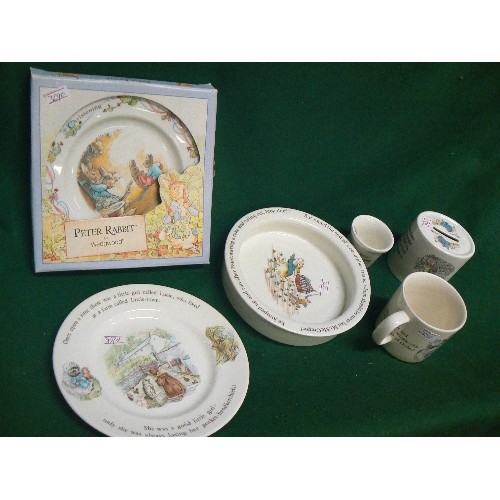 76 - A SELECTION OF WEDGWOOD PETER RABBIT THEMED CHINA TO INCLUDE TWO PLATES, A BOWL, A CUP, AN EGGCUP AN... 