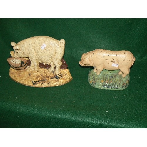 281 - TWO DECORATIVE CAST IRON PIG DOORSTOPS