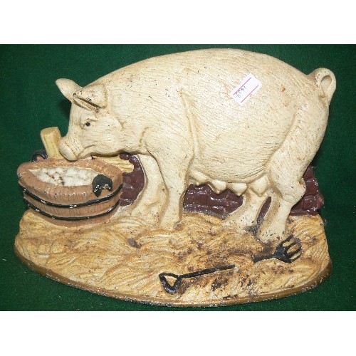 281 - TWO DECORATIVE CAST IRON PIG DOORSTOPS