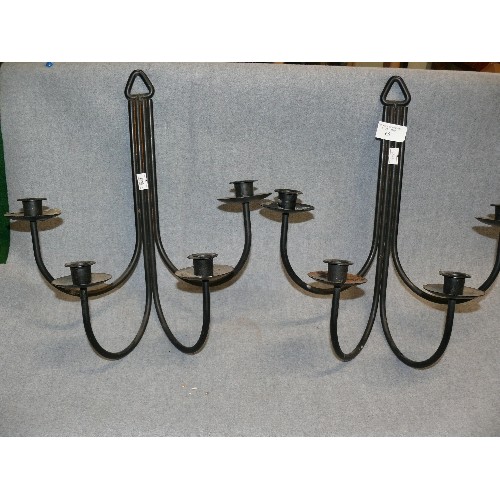 65 - A PAIR OF BLACK METAL WALL CANDLE SCONCES