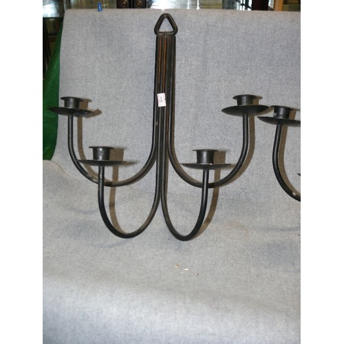 65 - A PAIR OF BLACK METAL WALL CANDLE SCONCES