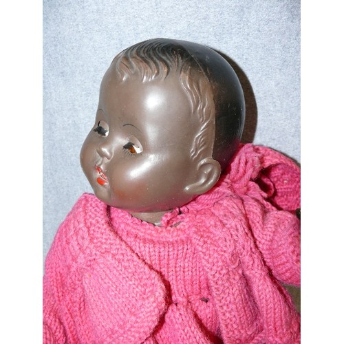 69 - A 1950'S BLACK BABY DOLLY BY ROSEBUD, MADE IN ENGLAND.