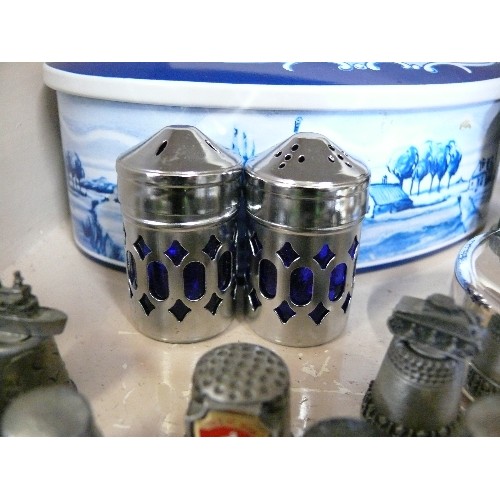 82 - A BLUE & WHITE DELFT STYLE TIN WITH CONTENTS OF SILVERPLATE AND PEWTER ITEMS TO INCLUDE A VERY GOOD ... 