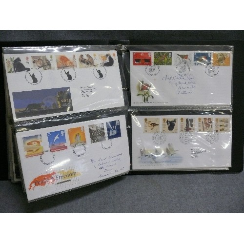 104 - AN ALBUM CONTAINING 80 DIFFERENT FIRST DAY COVERS 1965-2003