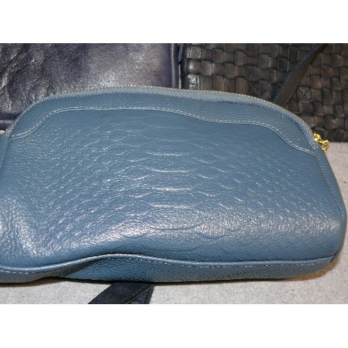 106 - THREE GOOD QUALITY BLUE LEATHER HANDBAGS INCLUDING ONE BY OSPREY