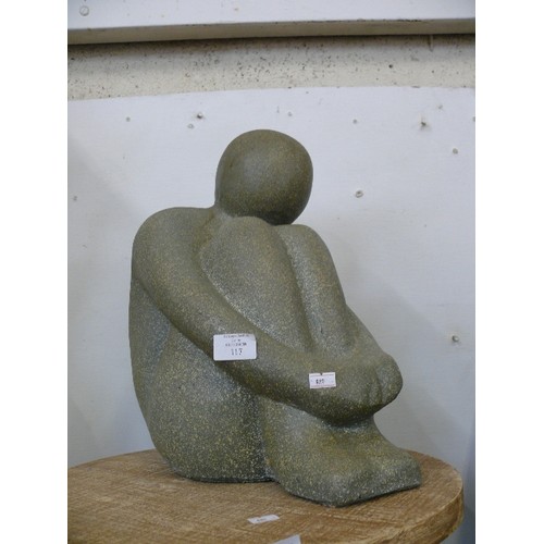 117 - A LARGE DECORATIVE TERRACOTTA FIGURE OF A PERSON SITTING DOWN