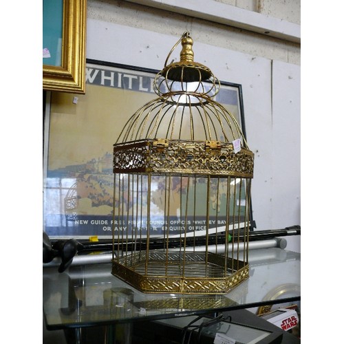 141B - A LARGE DECORATIVE GOLD COLOURED HANGING BIRD CAGE