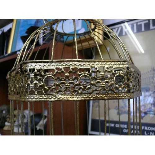 141B - A LARGE DECORATIVE GOLD COLOURED HANGING BIRD CAGE