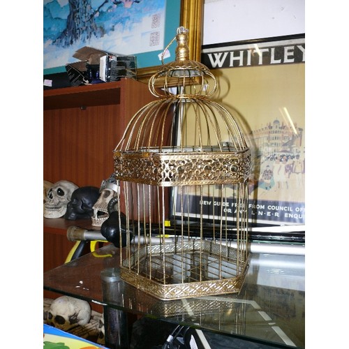 141B - A LARGE DECORATIVE GOLD COLOURED HANGING BIRD CAGE