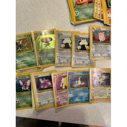 33 - Over 70 Pokemon cards - Base Fossil & Jungle including Halos