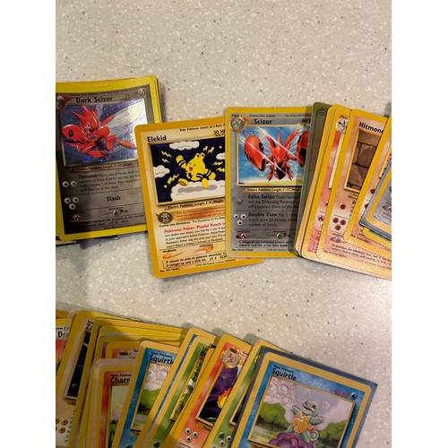 33 - Over 70 Pokemon cards - Base Fossil & Jungle including Halos