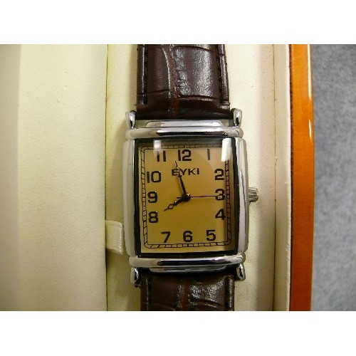 19 - A VINTAGE EYKI WATCH WITH BROWN STRAP