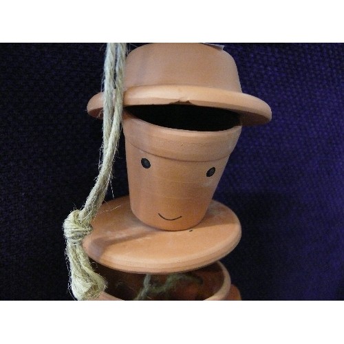 118A - HANGING FLOWER POT MAN ORNAMENT