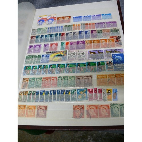 57 - 4 WELL FILLED STOCK BOOKS  OF STAMPS INCLUDING GEORGE V EARLY BRITISH, CEYLON, RHODESIA - MANY HUNDR... 