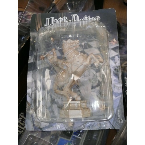 138 - THREE BOXES CONTAINING A LARGE QUANTITY  OF VARIOUS HARRY POTTER CHESS PIECES AND COLLECTORS ITEMS M... 