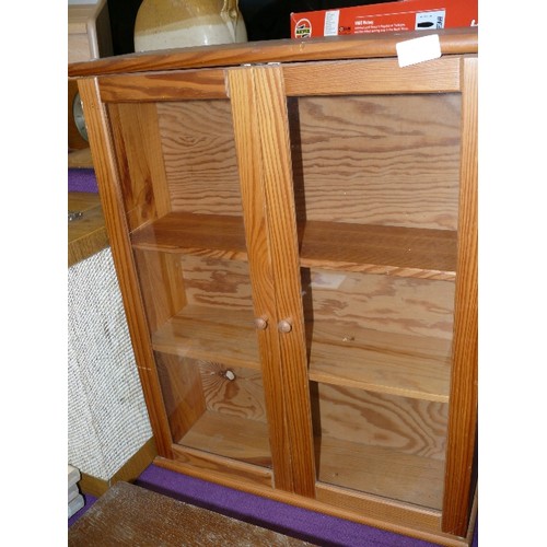 45B - A SMALL PINE SHELVED WALL CUPBOARD WITH GLAZED DOORS