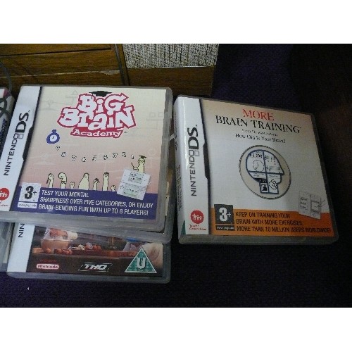 46A - A RED NINTENDO DSLITE IN A BABY PINK CASE WITH CHARGER AND VARIOUS GAMES TO INCLUDE RATATOUILLE, STO... 