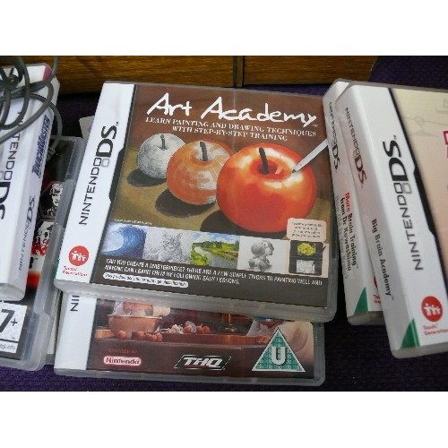 46A - A RED NINTENDO DSLITE IN A BABY PINK CASE WITH CHARGER AND VARIOUS GAMES TO INCLUDE RATATOUILLE, STO... 