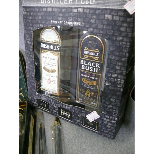 149 - A SELECTION OF BUSHMILLS WHISKY, ALL BOXED PLUS MATCHING COASTERS AND 2 GUINNESS PENS PLUS A PAIR OF... 