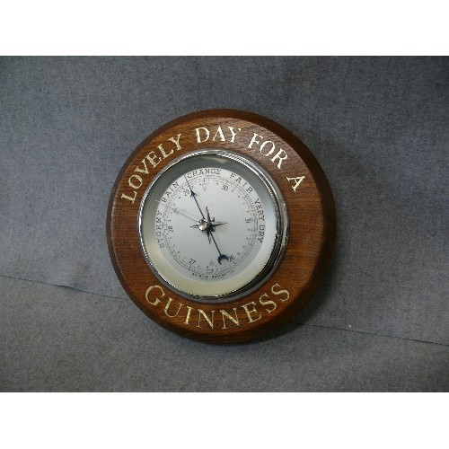 158 - A WOODEN CASED ANEROID BAROMETER WITH 'LOVELY DAY FOR A GUINNESS' MOTIF