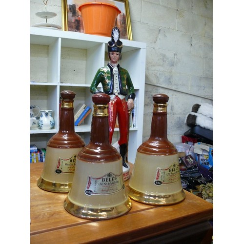 235 - AN IRISH MIST IRELAND'S LEGENDARY LIQUEUR SOLDIER DECANTER PLUS 3 BELLS WHISKY DECANTERS