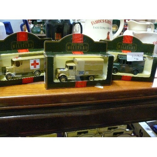 226 - 3 BOXED 'DAYS GONE MILITARY' VEHICLES MORRIS LIGHT TRUCK, 1934 MACK CANVAS BACK TRUCK AND A 1932 DEN... 