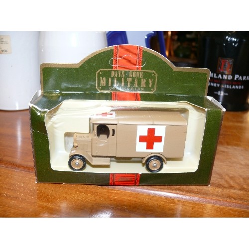 226 - 3 BOXED 'DAYS GONE MILITARY' VEHICLES MORRIS LIGHT TRUCK, 1934 MACK CANVAS BACK TRUCK AND A 1932 DEN... 