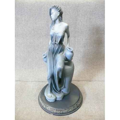 124A - A FIGURINE OF AQUARIUS FROM THE SIGNS OF THE ZODIAC BY CLARECRAFT