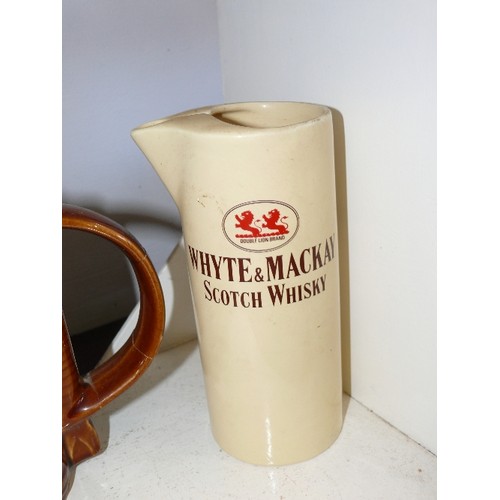 111 - 4 WHISKY ADVERTISING WATER JUGS FEATURING WHYTE & MCKAY, VAT 69, 100 PIPERS AND JOHNNIE WALKER