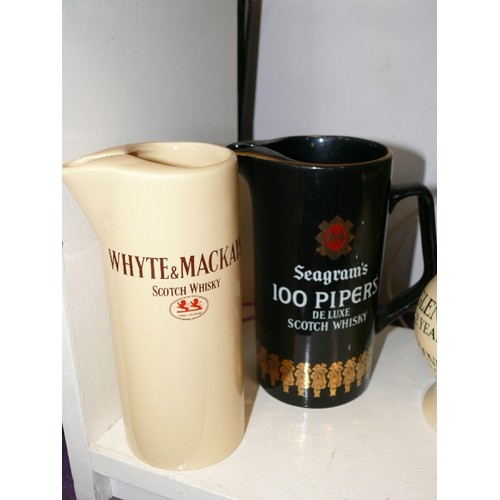 109 - 4 WHISKY ADVERTISING WATER JUGS FEATURING WHITE & MCKAY, GLENLIVET, VAT 69 AND SEAGRAM'S 100 PIPERS