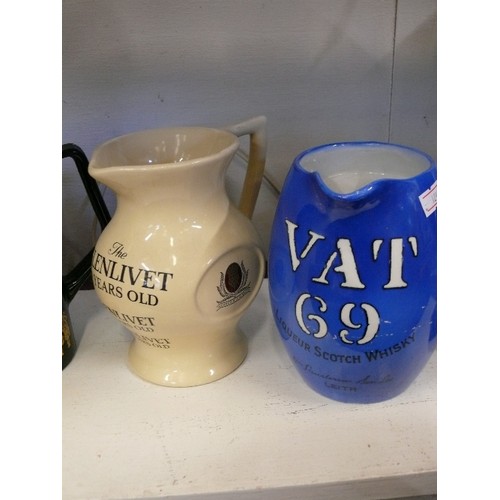 109 - 4 WHISKY ADVERTISING WATER JUGS FEATURING WHITE & MCKAY, GLENLIVET, VAT 69 AND SEAGRAM'S 100 PIPERS