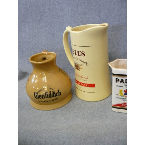 145 - FOUR WHISKY ADVERTISING WATER JUGS FEATURING BELL'S, GLENFIDDICH, PADDY AND BLACK BUSH