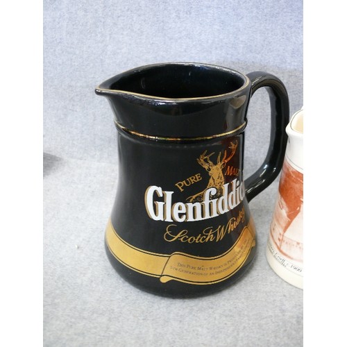 154 - 4 WHISKY ADVERTISING WATER JUGS FEATURING GLENFIDDICH, GLENTURRET, SEAGRAM'S 7 AND BLACK PRINCE