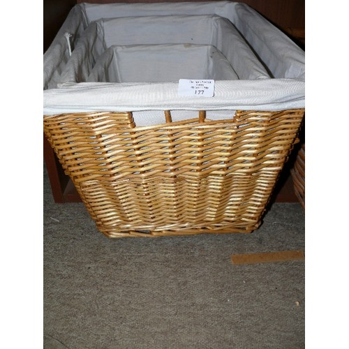 177 - A SET OF THREE GOOD QUALITY LINED WICKER BASKETS